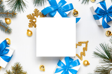 Fototapeta na wymiar Christmas ornaments. White gift box with blue ribbon, New Year balls and Christmas tree in xmas composition on white background for greeting card. Decoration, copy space for your text.