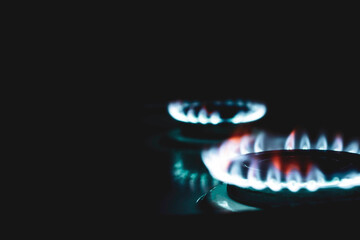 ignition of gas with a hand lighter at night, the foreground and background are blurred with bokeh...
