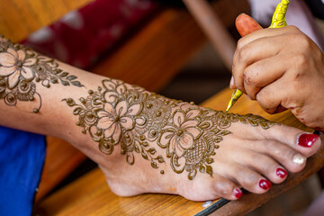 henna painting on foot