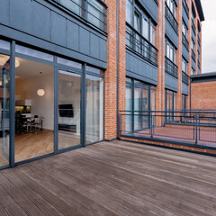 Spacious balcony with wooden floor