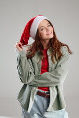 cute girl in a cap with a pom-pom and a jacket holidays Christmas  
