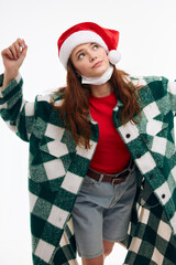 woman in plaid coat medical mask christmas hat look up 