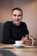 Portrait of a handsome young man. Shooting in the interior