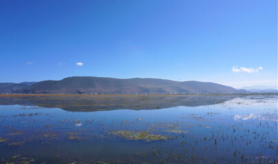 Napa Lake surrounded by Mountain in Shangri La, Yunnan Province, China.