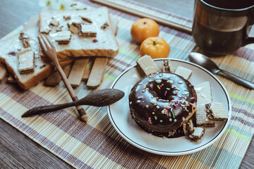 Rustic breakfast, Donut is placed on an artistic table, Soft focus.