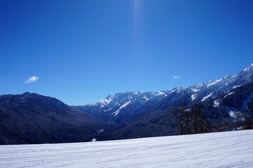 Fototapeta na wymiar Winter landscape in the mountains of the Caucasian ridge, ski slopes.