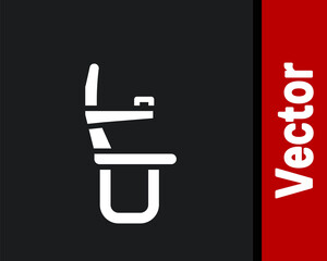White Airplane seat icon isolated on black background. Vector.