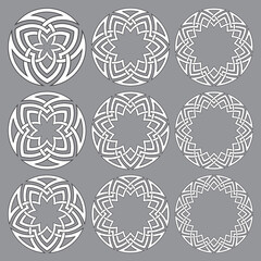 Set of round frames. Nine decorative elements for logo design with stripes braiding borders. White lines with black strokes on gray background.