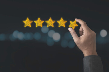 Customer satisfaction and product service evaluation concept , Hand holding and put yellow star to...