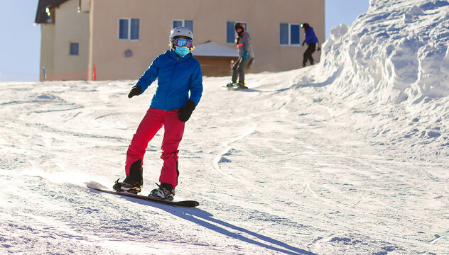 Coronavirus In Winter. Skiing With Face Mask. Winter Vacation In Pandemia. Portrait Of Caucasian Young Man With Face Mask. Winter Is Coming In New Reality.