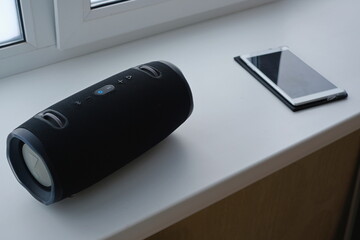 music system and tablet on the window