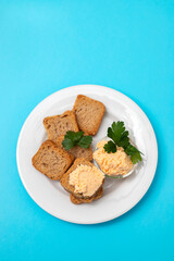 toasts with fish pate on white plate