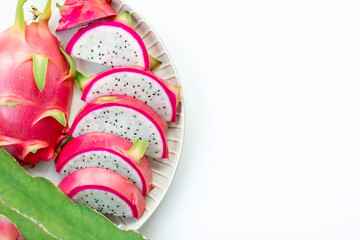 Fototapeta na wymiar Sliced pink dragon fruit in plate isolated on white background