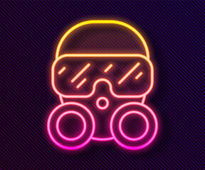 Glowing neon line Gas mask icon isolated on black background. Respirator sign. Vector.