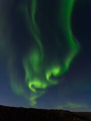 Beautiful northern lights in winter over the tunra and hills.