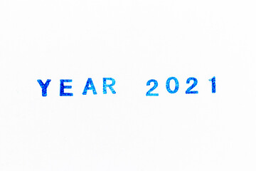 Blue color ink of rubber stamp in word 2021 year on white paper background