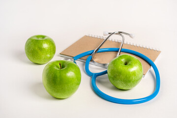 Apples and stethoscope medical as a health concept. White background, space for text.