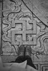 swastika sign on pedestrian tiles. Over view.