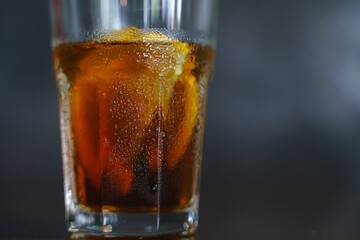 Iced cold brew coffee with slice of orange