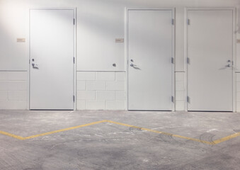 White doors in parking lot.