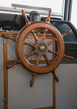 Steering wheel in boat's cabin.