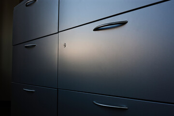 Filing cabinet with handle.