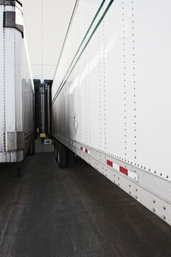 Lorries docked at a warehouse.