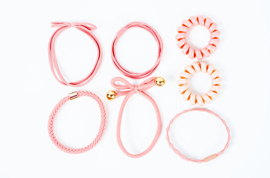 Set of pink fabric rubber bands.