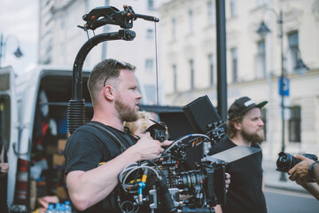 Director of photography with a camera in his hands on the set