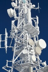 Communication transmitter tower with thick ice layer frost in cold winter