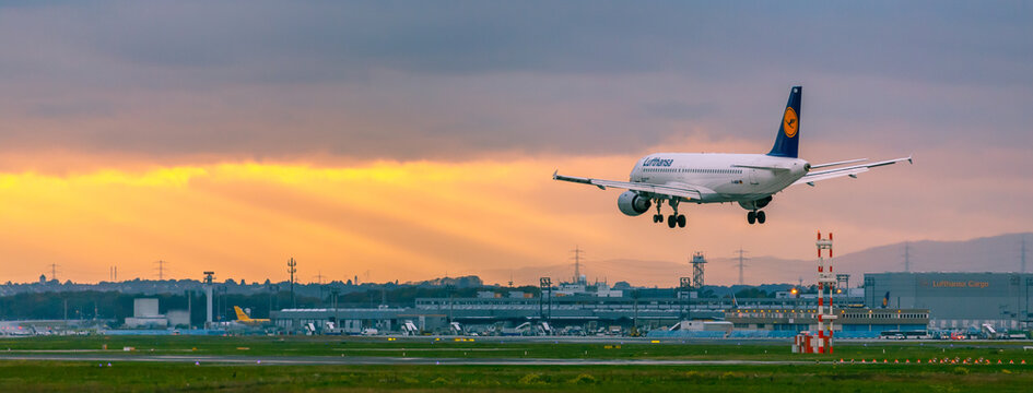 Lufthansa Airplane Landing At Sunset