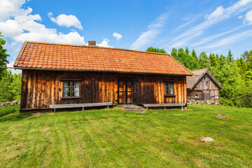 Old idyllic wooden cottage in the country