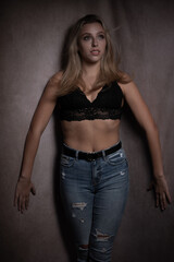 Moody dark portrait of a beautiful young woman