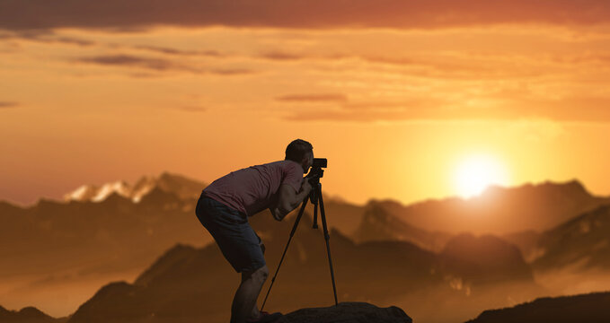 a photographer taking photos of wonderful sunset landscapes.