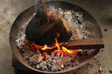 In the cold days it is fun to cook fire,Burning dry wood in large pot