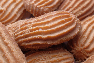 close up of sweet cookies on wooden table 