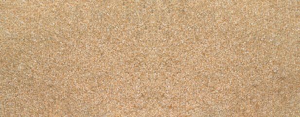 Fototapeta na wymiar sand texture, beach background banner, grains of sand with copy space