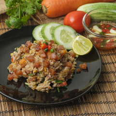 Fried rice with sliced chinese sausage decorate by ingredient on wooden decoration style.