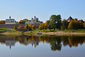 Autumn view of the Novgorod Kremlin with reflection in the water of the Volkhov River. Veliky Novgorod. Russia. Saint Sophia Cathedral and belfry