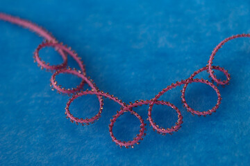 blue background with pink tape curls - close up, event decoration