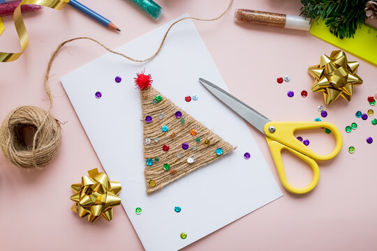 DIY concept. How to make Christmas card. New Year idea for children. Step-by-step photo instructions. Decorate card with christmas tree.Children's creativity. Step 8. Ready greeting card