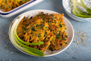 Vegetable patty with pumpkin, onion and dill. Pumpkin fritters.