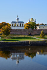 Autumn view of the Novgorod Kremlin with reflection in the water of the Volkhov River. Veliky Novgorod. Russia. Saint Sophia Cathedral and belfry