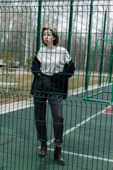 portrait of a young woman in a park