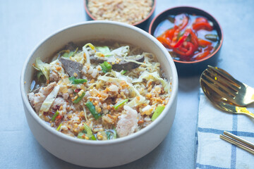 Egg noodle soup with many fresh vegetable and many topping, Thai noodle style