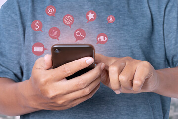 man using smartphone with notification icons network on social media.