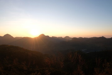 Sunset on mountains panoramic view in nature wallpaper background