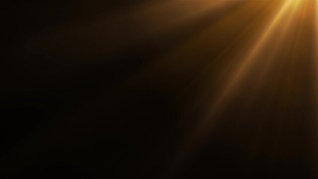 Animated golden light rays on dark background