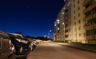 Outdoor parking lot at night in Lasnamae, Tallinn.