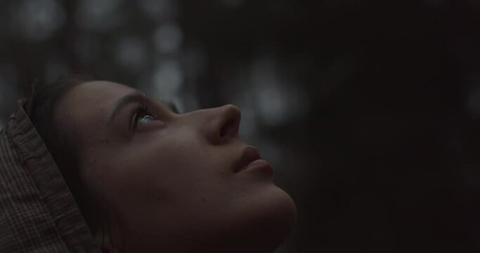 Close Up Portrait Of Young Caucasian Woman Looks Up At Sky And Enjoys Life. Beautiful Woman Thinks About Future Or Prays With Hope Outdoors. Achievement Success Motivation Self-made Person Concept 